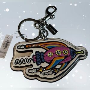 Coach cosmic rocket charm